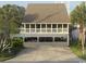 Coastal home with a covered area that has been turned into an entertaining space at 404 29Th Ave. N, North Myrtle Beach, SC 29582
