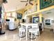 Bright, open-concept living area with a large kitchen island, modern appliances, and loft with a staircase at 404 29Th Ave. N, North Myrtle Beach, SC 29582