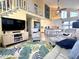 Spacious living room featuring vaulted ceilings, staircase, and a coastal vibe with comfortable seating and stylish decor at 404 29Th Ave. N, North Myrtle Beach, SC 29582