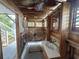 Detailed wooden outdoor shower featuring wooden floors and vintage finishes at 404 29Th Ave. N, North Myrtle Beach, SC 29582