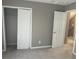 Neutral bedroom showcasing gray walls and carpet, as well as white trim and doors at 433 Emerson Dr., Myrtle Beach, SC 29579