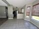 Spacious dining area with grey tile flooring and abundant natural light at 433 Emerson Dr., Myrtle Beach, SC 29579
