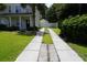 Long driveway leading to a fenced backyard and detached garage, with a well-maintained lawn at 433 Emerson Dr., Myrtle Beach, SC 29579