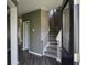 Welcoming home foyer featuring sleek floors and staircase, offering a glimpse into the home's layout at 433 Emerson Dr., Myrtle Beach, SC 29579