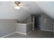 Hallway features wood-look floors, neutral paint, and a ceiling fan, leading to bathroom at 433 Emerson Dr., Myrtle Beach, SC 29579