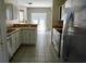 Kitchen with stainless steel appliances, white cabinets and breakfast bar at 433 Emerson Dr., Myrtle Beach, SC 29579