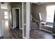 Open living area with modern flooring and a view of the staircase, filled with natural light at 433 Emerson Dr., Myrtle Beach, SC 29579