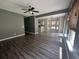 Spacious living room featuring wood-look floors and ample natural light, perfect for entertaining or relaxing at 433 Emerson Dr., Myrtle Beach, SC 29579