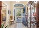 Bright foyer with a decorative wreath on the front door and wood-look flooring at 4610 Fringetree Dr., Murrells Inlet, SC 29576