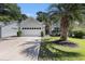 Charming single-story home with a well-manicured lawn, palm tree and an attached two car garage at 4610 Fringetree Dr., Murrells Inlet, SC 29576