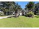 Charming single-story home with a manicured lawn and a large palm tree in the front yard at 4610 Fringetree Dr., Murrells Inlet, SC 29576