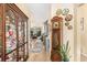 Inviting hallway with hardwood floors leading to a spacious living room with ample natural light at 4610 Fringetree Dr., Murrells Inlet, SC 29576