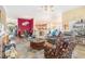 Open-concept living room with colorful decor, a ceiling fan, and hardwood floors at 4610 Fringetree Dr., Murrells Inlet, SC 29576
