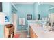 Bright main bathroom featuring dual sinks, a shower and vanity with storage at 4610 Fringetree Dr., Murrells Inlet, SC 29576