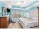 Comfortable main bedroom with recessed ceiling, natural light, and tasteful decor at 4610 Fringetree Dr., Murrells Inlet, SC 29576