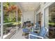 A sunroom provides a relaxing space with views of a lush backyard, trees and an adjacent home at 4610 Fringetree Dr., Murrells Inlet, SC 29576