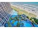 Stunning aerial view of resort pools, palm trees, beach and the ocean at 4800 Ocean Blvd. S # 1119, North Myrtle Beach, SC 29582