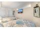 Spacious bedroom featuring two beds with nautical-themed bedding and a wall-mounted TV at 4800 Ocean Blvd. S # 1119, North Myrtle Beach, SC 29582