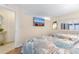 Comfortable bedroom with two beds, nautical-themed bedding, and a TV for a relaxing stay at 4800 Ocean Blvd. S # 1119, North Myrtle Beach, SC 29582