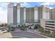 A large condo with palm trees, covered parking and sign saying Beach Cove Resort at 4800 Ocean Blvd. S # 1119, North Myrtle Beach, SC 29582