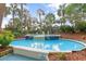A tranquil decorative fountain with playful dolphin accents surrounded by lush tropical landscaping at 4800 Ocean Blvd. S # 1119, North Myrtle Beach, SC 29582