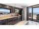 Kitchen with dark cabinets, stainless steel appliances and a view of the ocean at 4800 Ocean Blvd. S # 1119, North Myrtle Beach, SC 29582