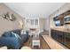Inviting living room showcasing a blue sofa, dining area, and a well-equipped kitchen at 4800 Ocean Blvd. S # 1119, North Myrtle Beach, SC 29582