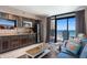 Living room with partial kitchen view, and a balcony with ocean view at 4800 Ocean Blvd. S # 1119, North Myrtle Beach, SC 29582