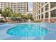Community swimming pool with lounge chairs and nearby access to hotel building at 4800 Ocean Blvd. S # 1119, North Myrtle Beach, SC 29582