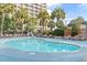 Inviting community pool with lounge chairs and easy access to the adjacent hotel at 4800 Ocean Blvd. S # 1119, North Myrtle Beach, SC 29582