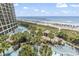 Gorgeous aerial view of a resort featuring pools, ocean, and beach access at 4800 S Ocean Blvd. # 520, North Myrtle Beach, SC 29582