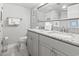 Bathroom with double sinks, granite countertops, and framed artwork at 4800 S Ocean Blvd. # 520, North Myrtle Beach, SC 29582