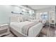 Bright bedroom with two beds, coastal decor, and shuttered windows with ocean view at 4800 S Ocean Blvd. # 520, North Myrtle Beach, SC 29582