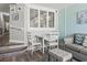 Cozy dining nook with seating for two people, and a view of the living room at 4800 S Ocean Blvd. # 520, North Myrtle Beach, SC 29582