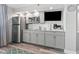 Efficient kitchenette with stainless steel appliances, granite countertops, and a TV at 4800 S Ocean Blvd. # 520, North Myrtle Beach, SC 29582