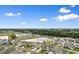 Aerial view of 490 Calhoun Falls Drive, showcasing the neighborhood and nearby pond at 490 Calhoun Falls Dr., Myrtle Beach, SC 29579