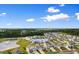 Aerial view of 490 Calhoun Falls Drive, showcasing the neighborhood and nearby pond at 490 Calhoun Falls Dr., Myrtle Beach, SC 29579