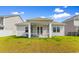 A well-maintained backyard featuring a covered patio, perfect for outdoor relaxation at 490 Calhoun Falls Dr., Myrtle Beach, SC 29579