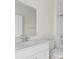 Bathroom featuring a white vanity, large mirror, and combined shower and tub at 490 Calhoun Falls Dr., Myrtle Beach, SC 29579
