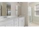 Bathroom with a double sink vanity, a shower and a view of the exterior at 490 Calhoun Falls Dr., Myrtle Beach, SC 29579