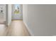Bright entryway with hardwood floors and white trim, leading to a sunlit view at 490 Calhoun Falls Dr., Myrtle Beach, SC 29579