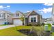 Charming one-story home showcasing stone and siding details and manicured landscaping at 490 Calhoun Falls Dr., Myrtle Beach, SC 29579