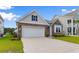 Charming home with stone and siding accents, white garage door, and well-manicured lawn at 490 Calhoun Falls Dr., Myrtle Beach, SC 29579