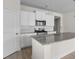 Bright kitchen showcasing granite countertops, white cabinets, and modern appliances at 490 Calhoun Falls Dr., Myrtle Beach, SC 29579