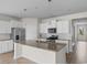 Modern kitchen features a granite island, stainless appliances, and white cabinetry at 490 Calhoun Falls Dr., Myrtle Beach, SC 29579