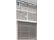 Close up of window with light filtering horizontal blinds at 490 Calhoun Falls Dr., Myrtle Beach, SC 29579