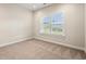 Bedroom featuring plush carpeting and window with blinds at 5004 Shore Breeze Dr., Myrtle Beach, SC 29588
