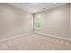 Bedroom with neutral carpet, white trim, and a window at 5004 Shore Breeze Dr., Myrtle Beach, SC 29588