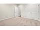 Bedroom with plush carpet, white trim, and closet doors at 5004 Shore Breeze Dr., Myrtle Beach, SC 29588