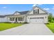 Lovely home with an attached two-car garage and a long concrete driveway at 5004 Shore Breeze Dr., Myrtle Beach, SC 29588